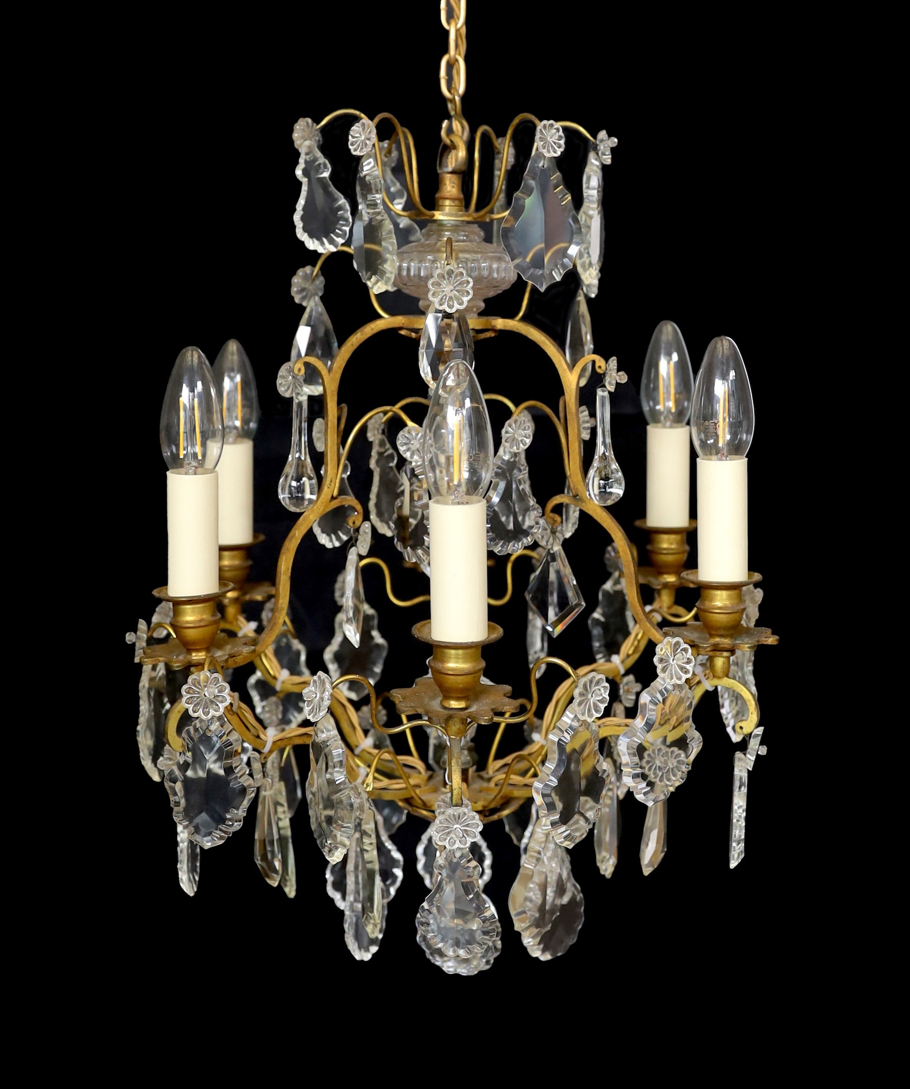 An early 20th century French gilt bronze and cut glass six light chandelier, height 54cm. width 40cm